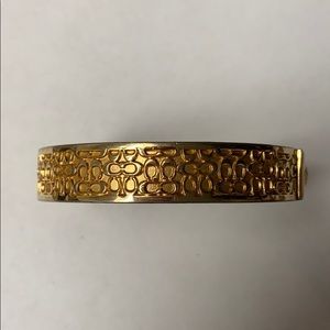 Gold tone Coach bracelet